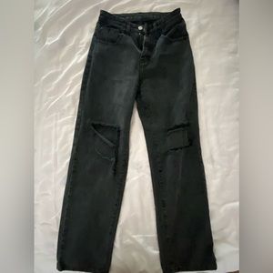High-waisted black ripped baggy jeans